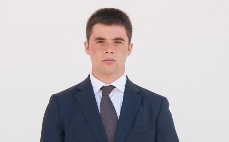 serious-man-formal-jacket-tie-standing-camera_1262-20387